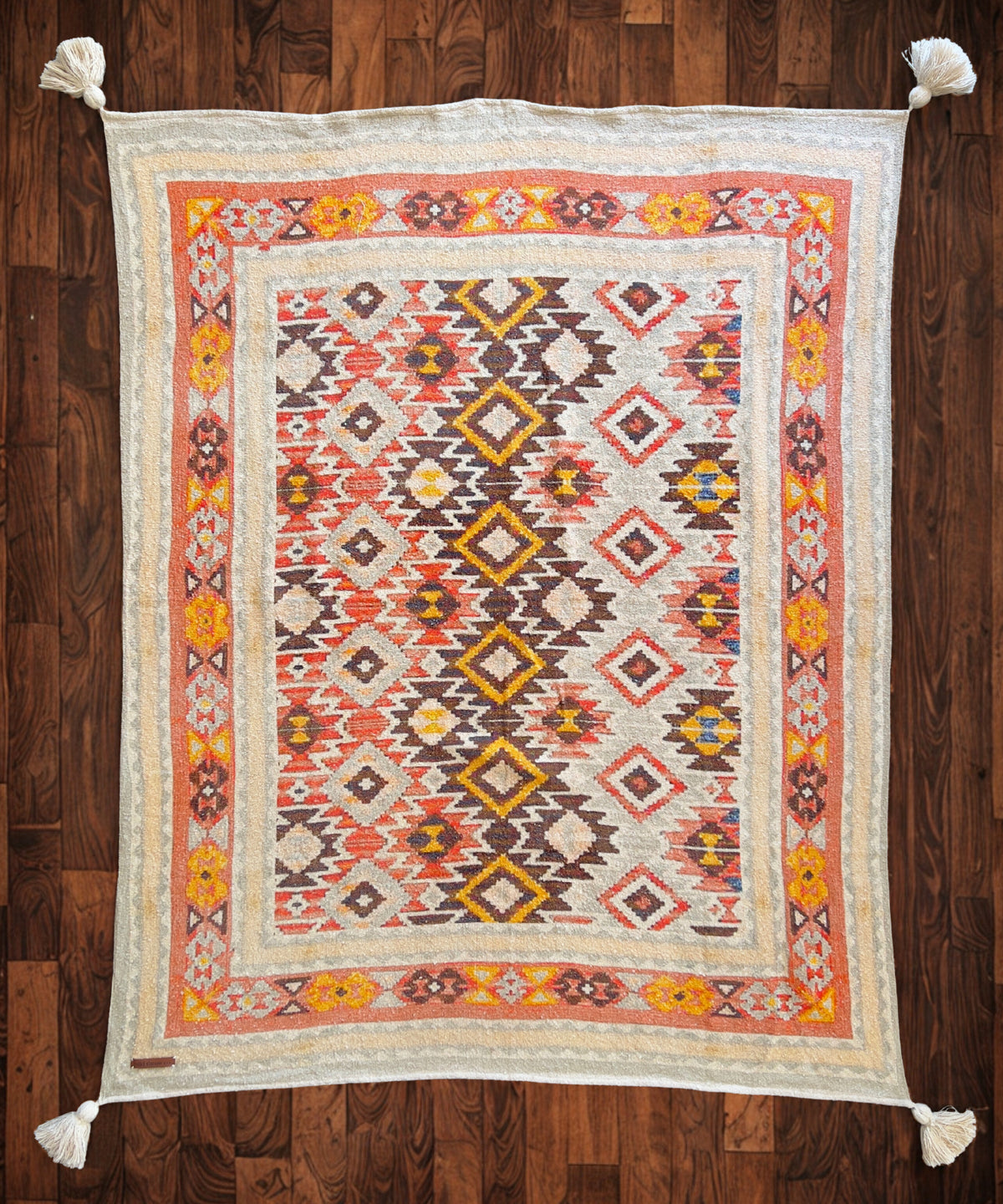 Decorative rug with geometric pattern on a wooden floor
